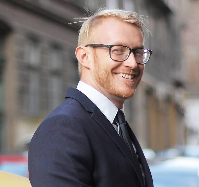 man with glasses smiling man with glasses smiling